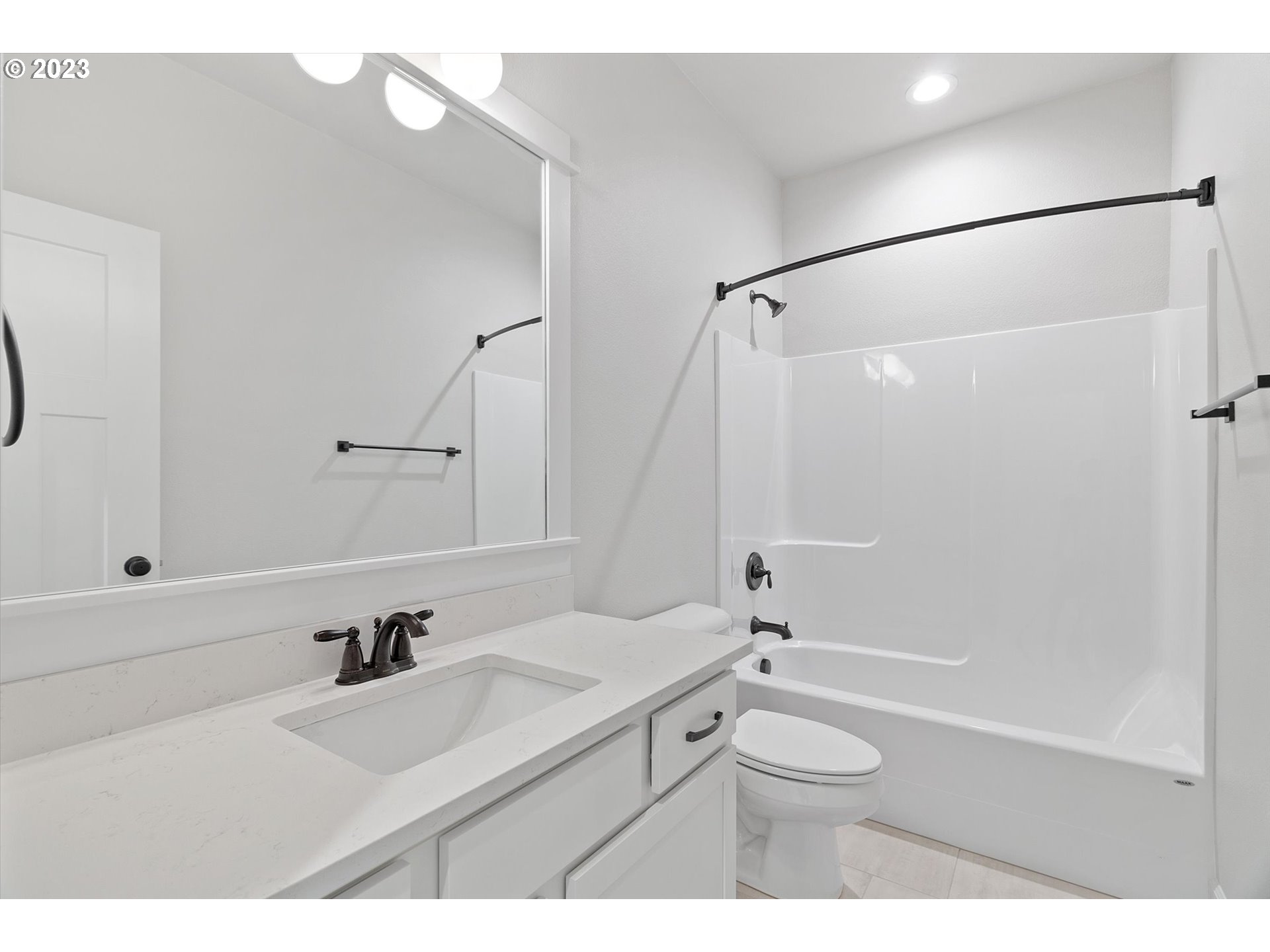 19699 Leland Road Oregon City, OR 97045 - Photo 18 of 38 a bathroom with a sink a toilet and a mirror