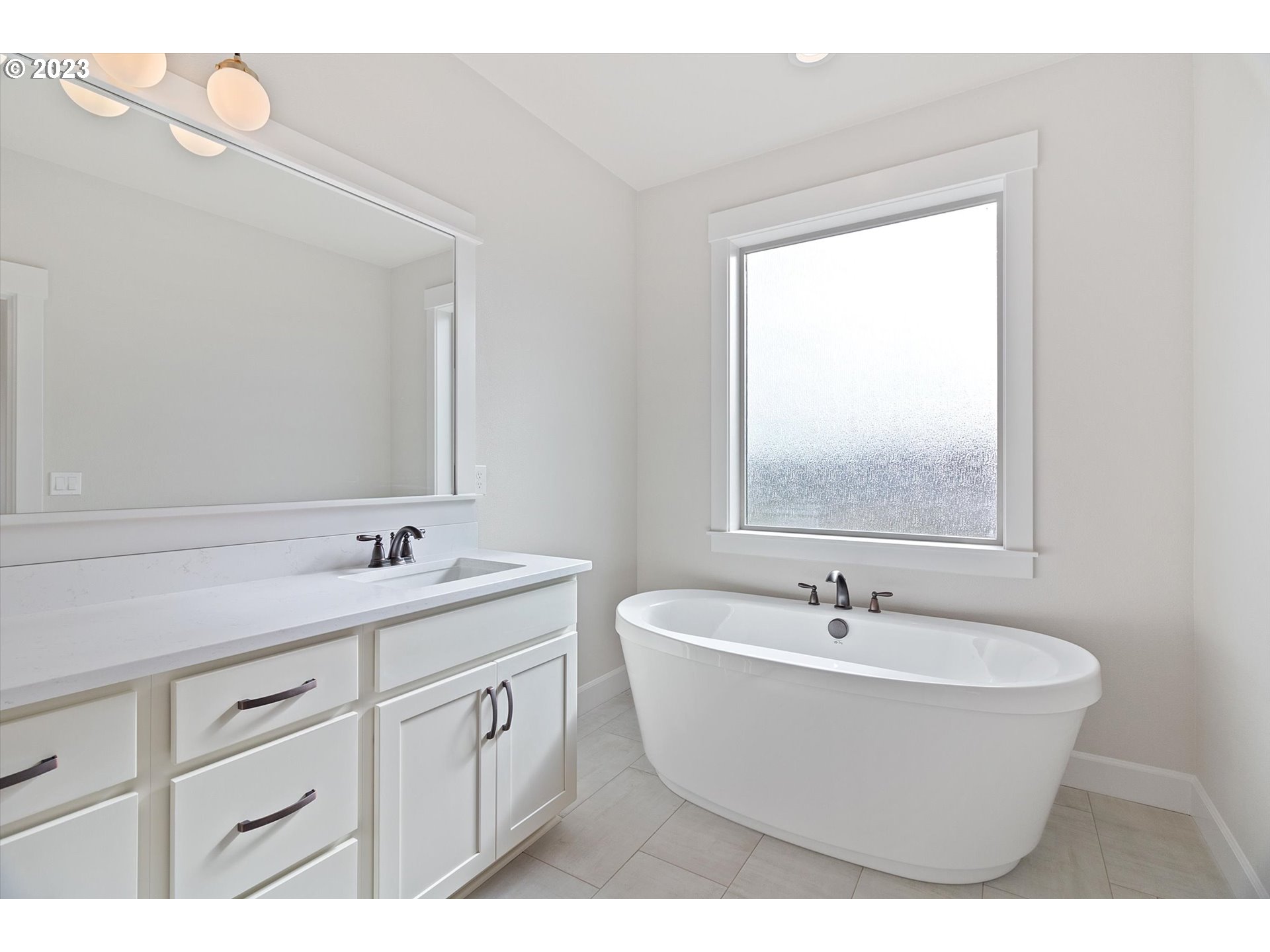 19699 Leland Road Oregon City, OR 97045 - Photo 29 of 38 a bathroom with a sink and a mirror