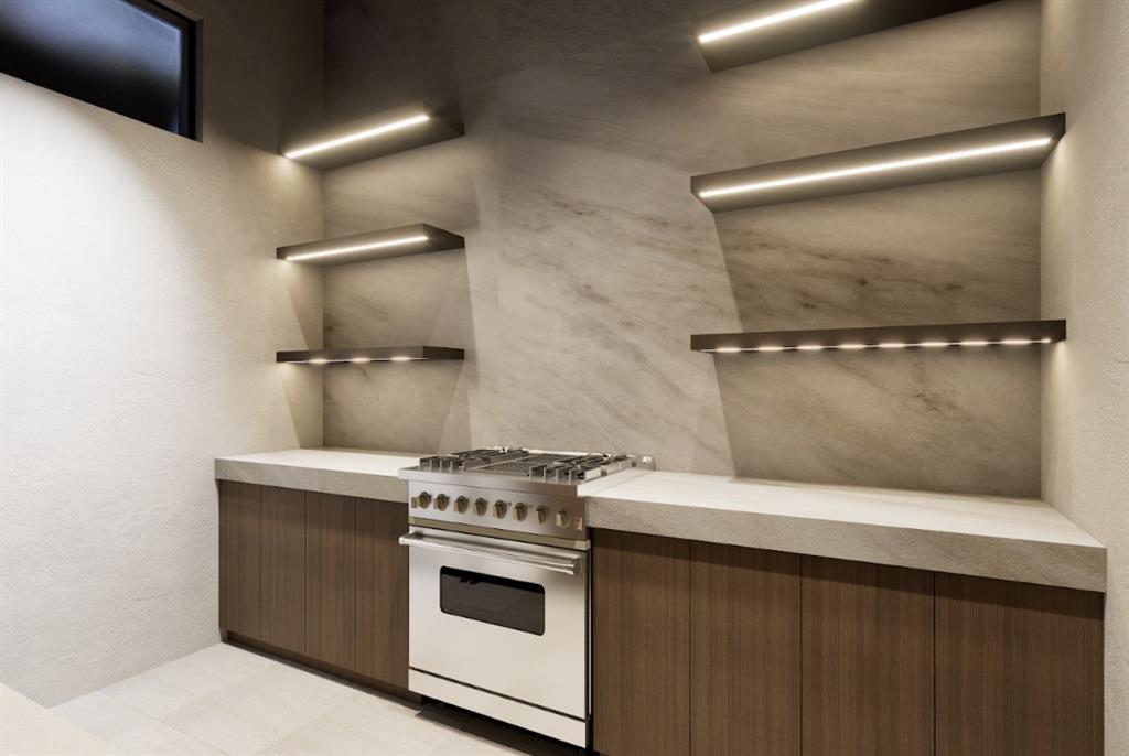 3905 Fieldview Way Wellington, FL 33414 - Photo 26 of 36 a kitchen with a stove and a microwave