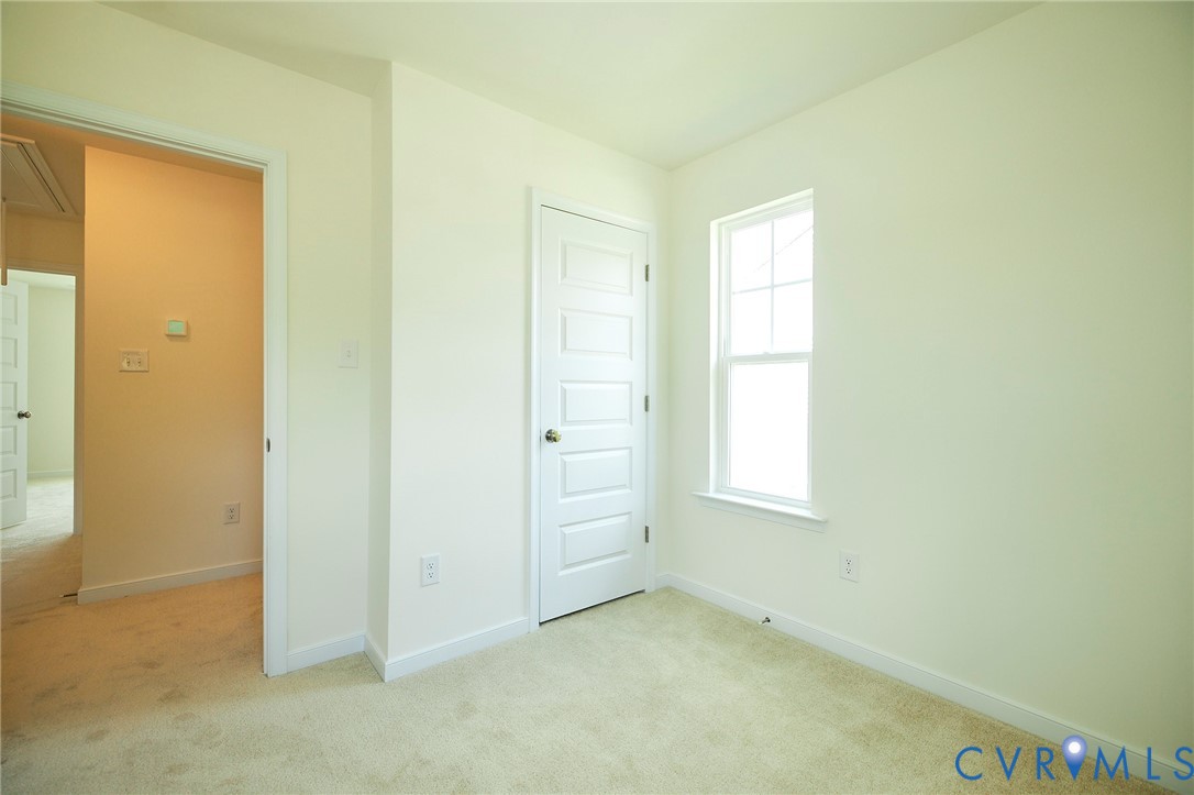 214 Greenpark Road Sandston, VA 23150 - Photo 33 of 50 Unfurnished bedroom featuring attic access and lig