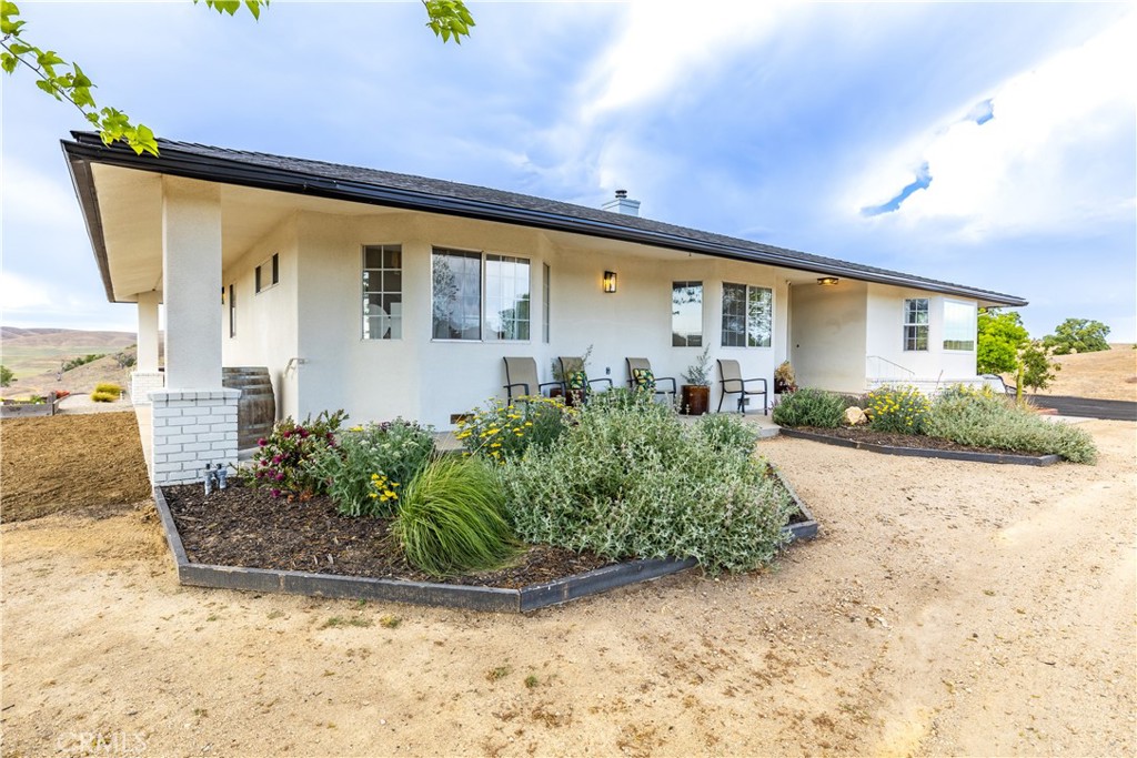 3150 Bluegrass Place Creston, CA 93432 - Photo 15 of 58 a front view of a house with garden
