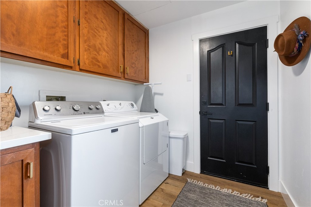 3150 Bluegrass Place Creston, CA 93432 - Photo 26 of 58 Laundry room leading to garage and half bath
