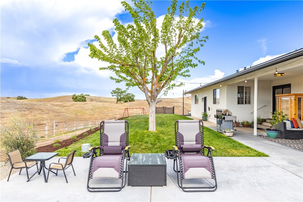 3150 Bluegrass Place Creston, CA 93432 - Photo 49 of 58 a view of a patio with chairs and a table