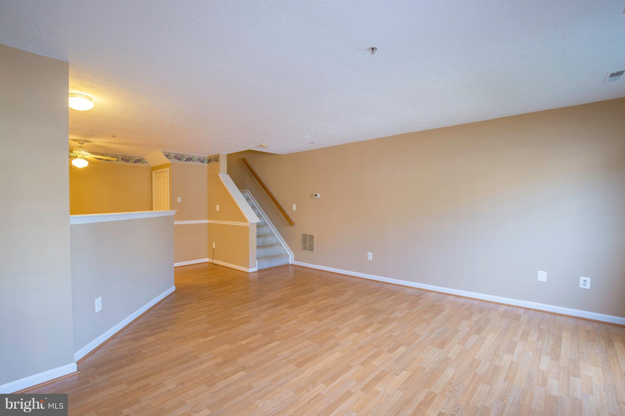 1820 Triple Feather Road, Unit 86 Severn, MD 21144 - Photo 5 of 22 Open Living/Dining Area on Main Level