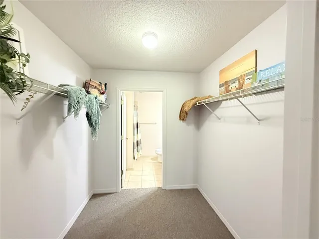 a view of a workspace with a window and chair