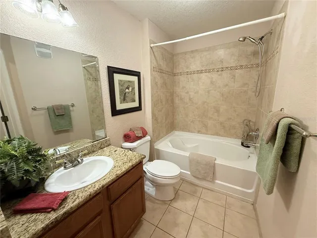 a bathroom with a toilet and a bath tub