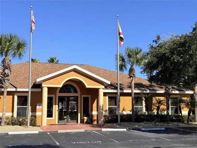a living room with furniture pool table and a chandelier