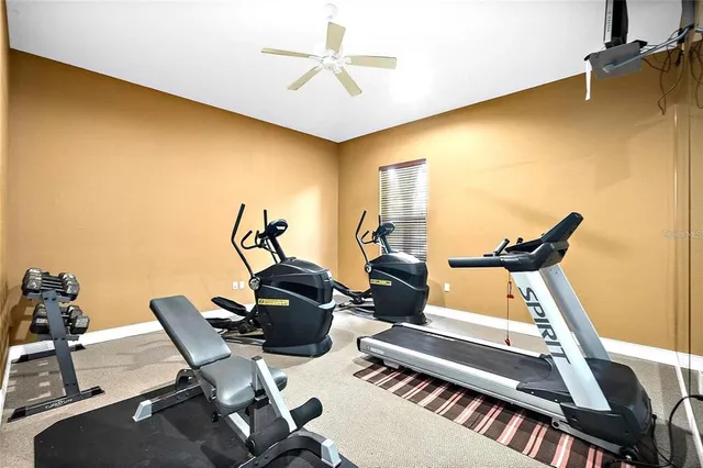 a view of a white house with a yard