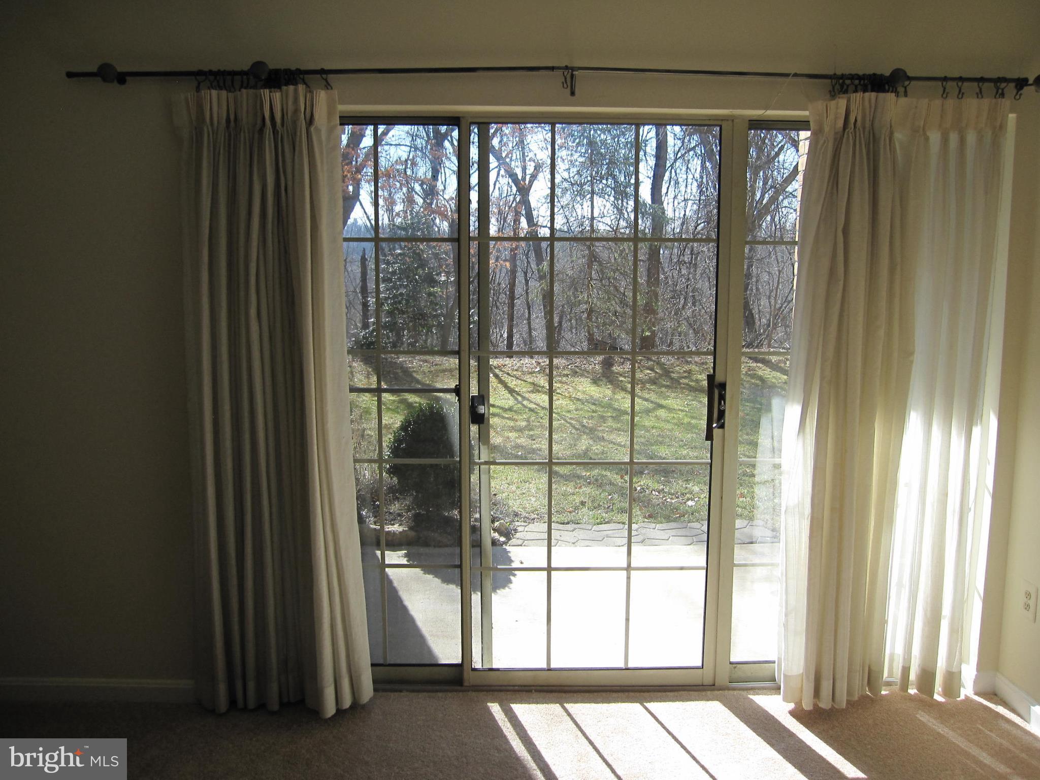 21 Rain Flower Path, Unit 103 Sparks, MD 21152 - Photo 10 of 27 View from Living Room to Patio
