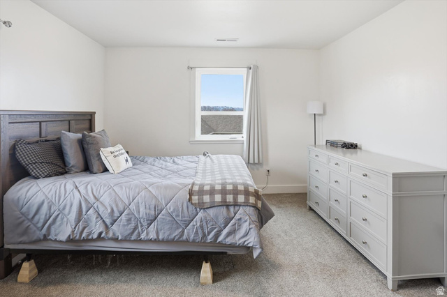 1009 High Creek Road Cove, UT 84320 - Photo 40 of 79 Bedroom featuring light colored carpet and baseboards