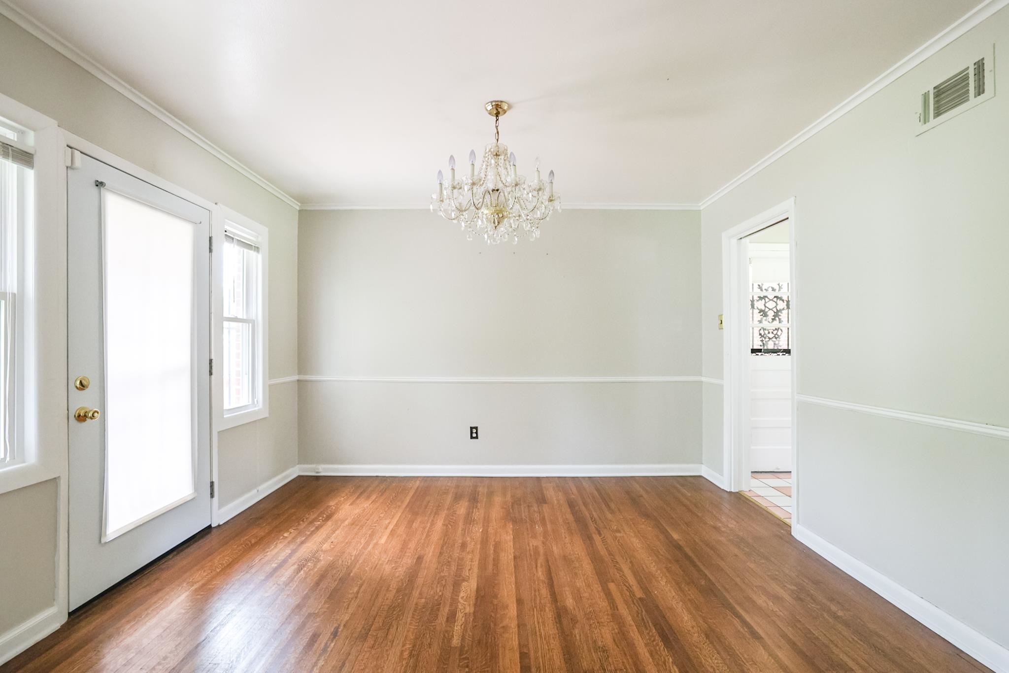 5136 Mason Road Memphis, TN 38117 - Photo 3 of 15 an empty room with wooden floor and windows