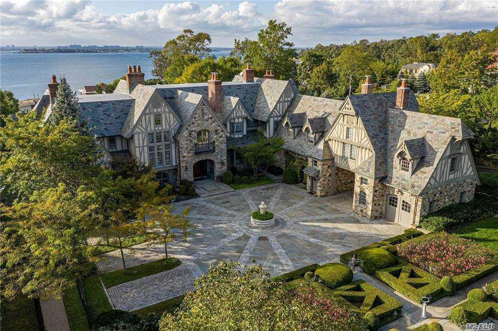 an aerial view of a house with yard swimming pool and outdoor seating