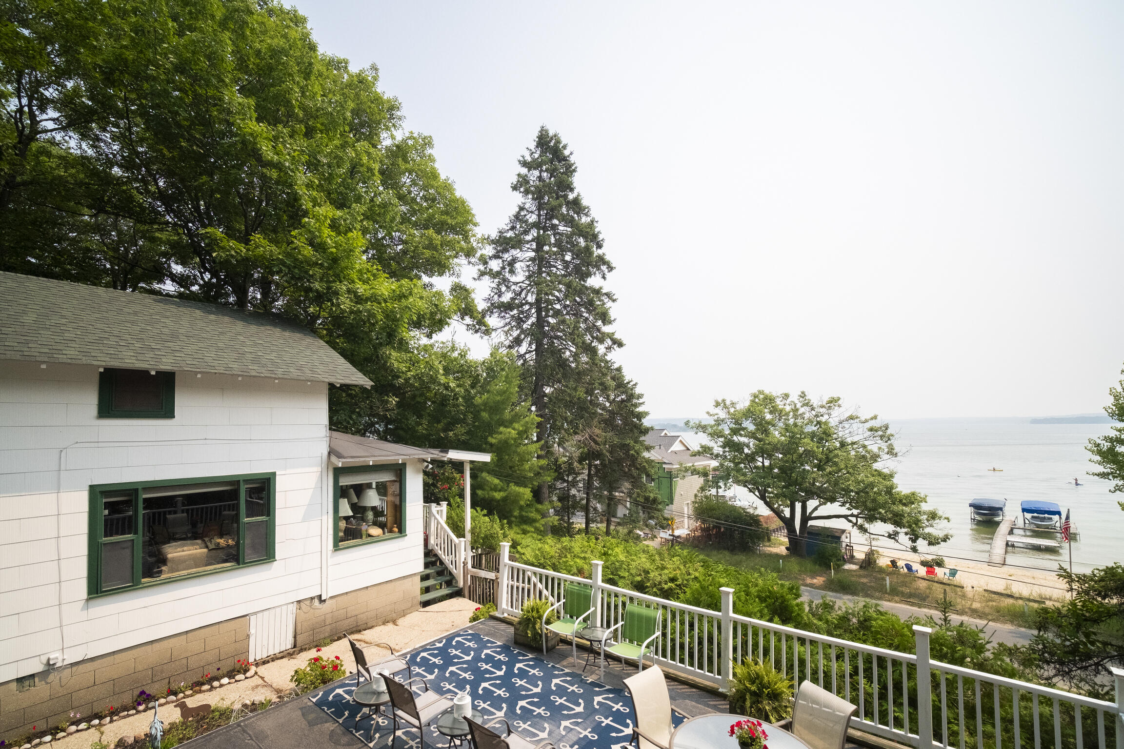 8368 Portage Point Drive Onekama, MI 49675 - Photo 18 of 68 Patio & West Side of Home