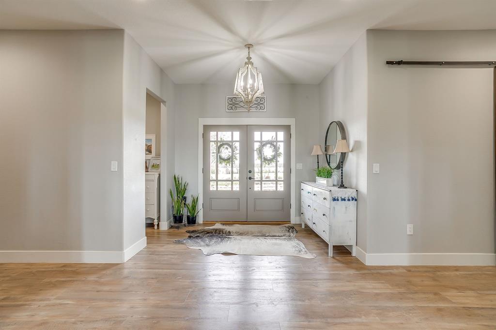 19611 North County Line Road Ponder, TX 76259 - Photo 11 of 40 a view of livingroom with kitchen and hardwood floor