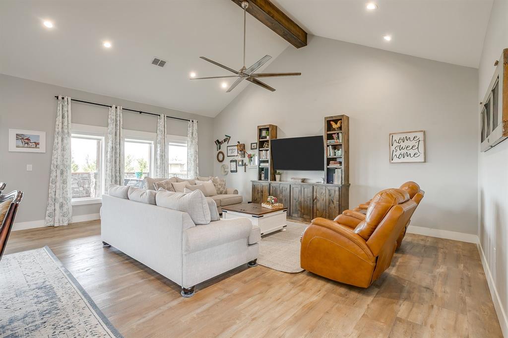19611 North County Line Road Ponder, TX 76259 - Photo 12 of 40 a living room with furniture and a flat screen tv