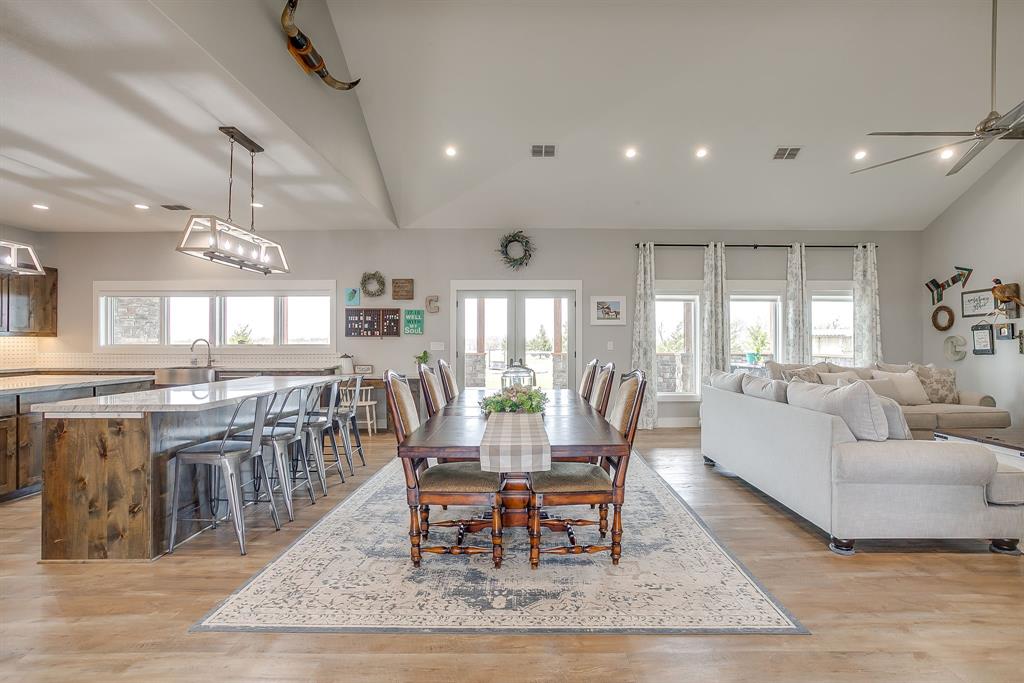 19611 North County Line Road Ponder, TX 76259 - Photo 16 of 40 a dining room with lots of tables a window and chairs