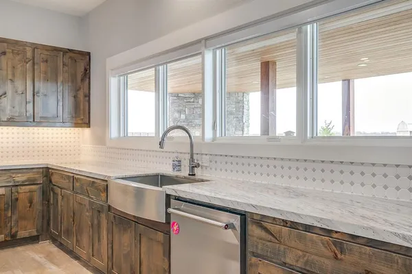 a kitchen with a sink and cabinets