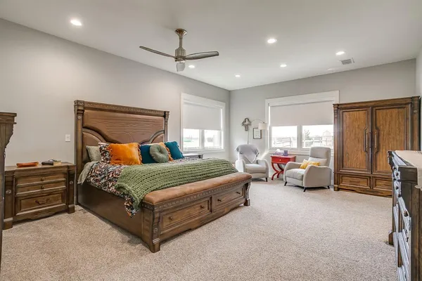 a bedroom with bed and window