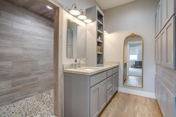 a bathroom with a sink and a mirror