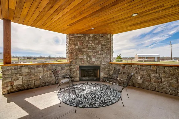 a swimming pool with outdoor seating