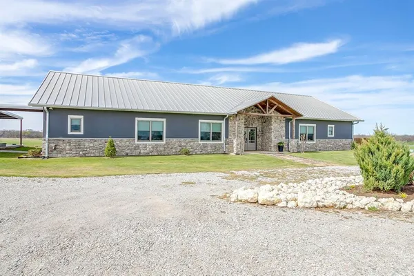 a view of house with outdoor space and swimming pool