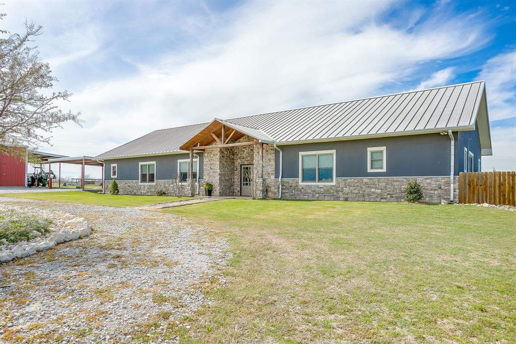 19611 North County Line Road Ponder, TX 76259 - Photo 9 of 40 a front view of a house with a yard