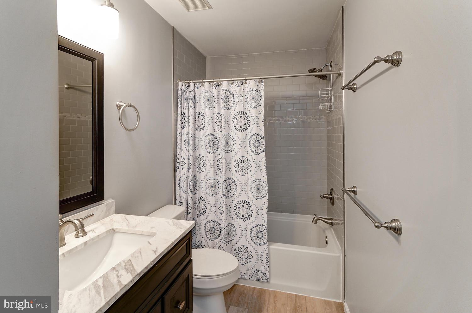 17 Windsor Pond Road Princeton Junction, NJ 08550 - Photo 4 of 20 a bathroom with a granite countertop sink toilet and shower