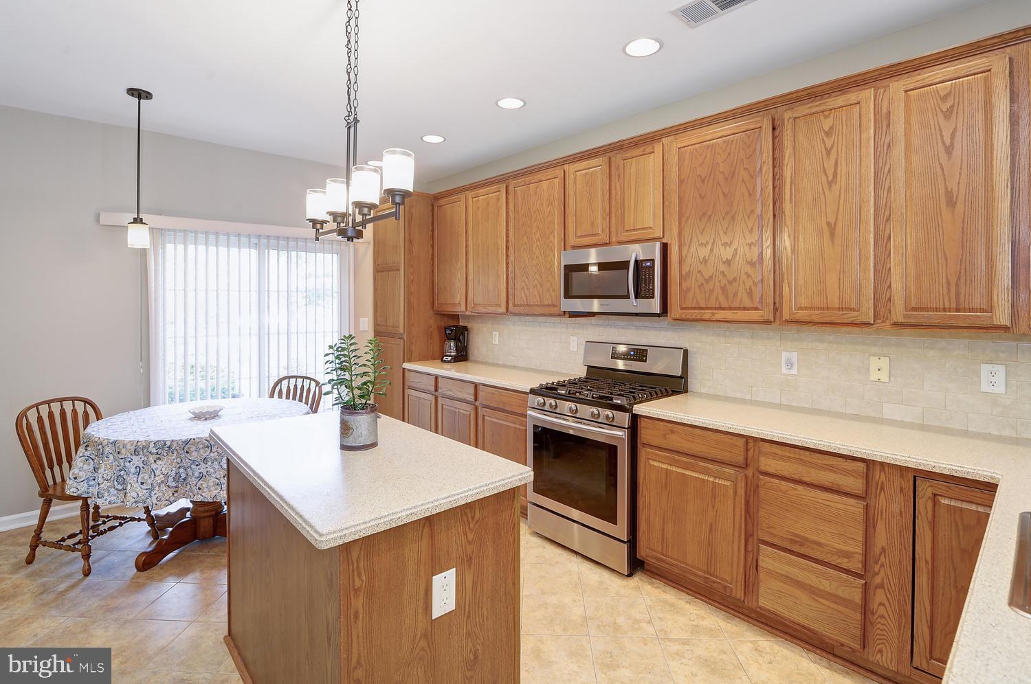 17 Windsor Pond Road Princeton Junction, NJ 08550 - Photo 5 of 20 a kitchen with a sink stove and microwave