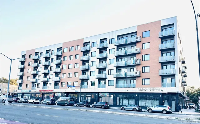 a view of an empty room with a kitchen