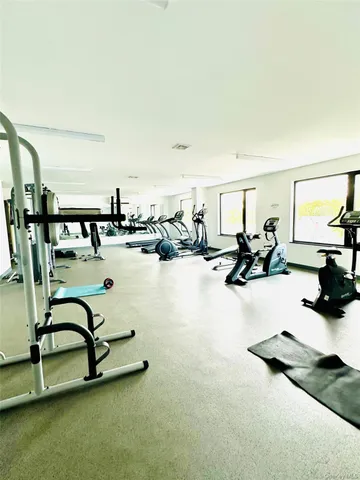 a view of a livingroom with furniture and window