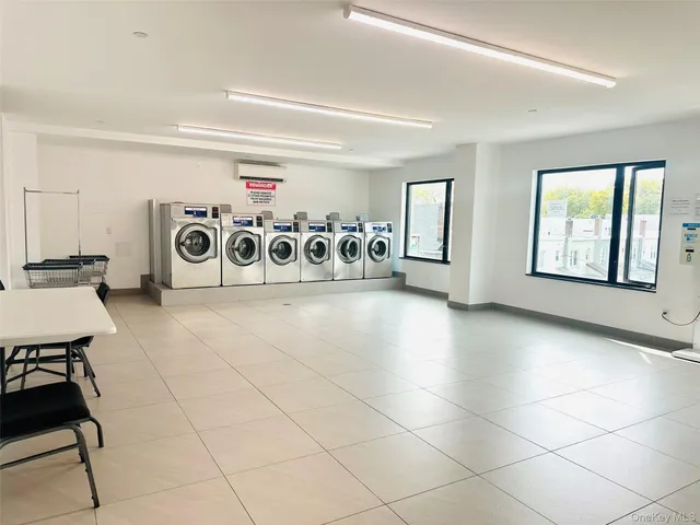 a bathroom with a sink mirror and shower