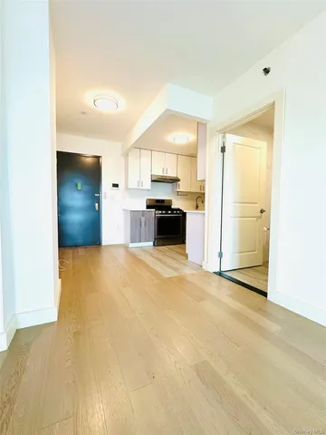 a kitchen with stainless steel appliances a stove a sink and cabinets