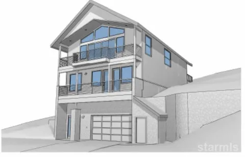 a view of a house with large windows