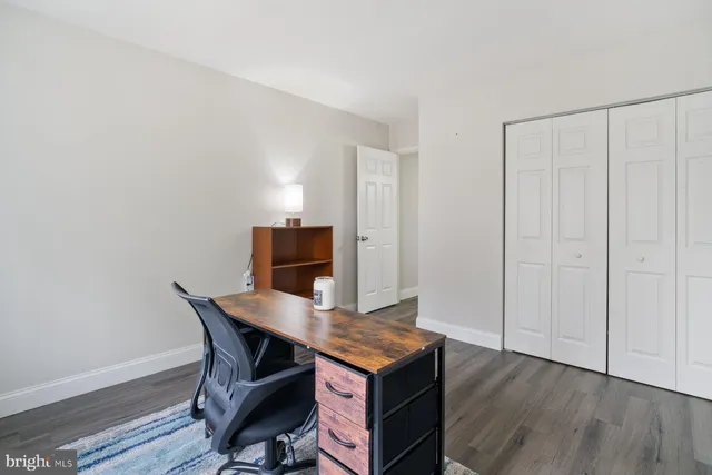 a workspace with furniture and wooden floor