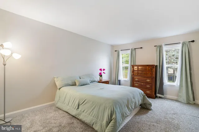 a bedroom with a bed and a closet