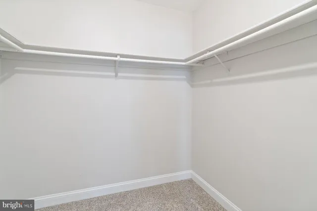 a view of a room with shelf on the wall