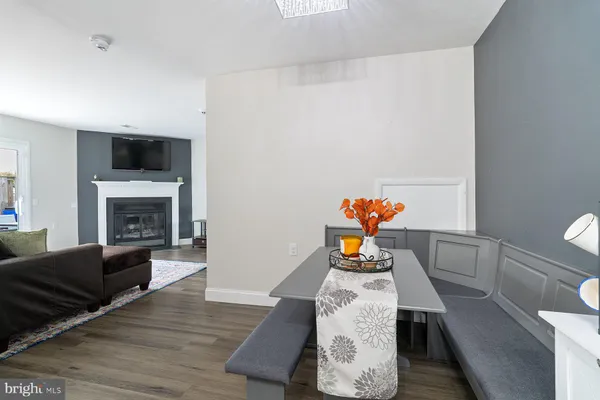 a living room with furniture fireplace and flat screen tv