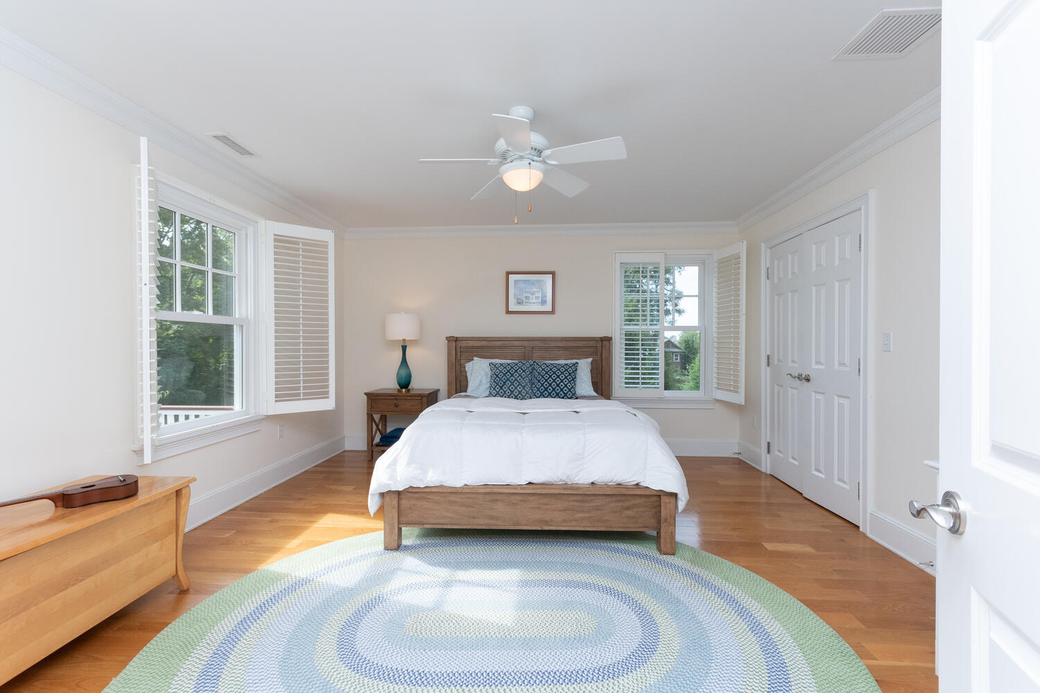 11 Harstrom Place Rowayton, CT 06853 - Photo 14 of 22 a spacious bedroom with a bed and wooden floor