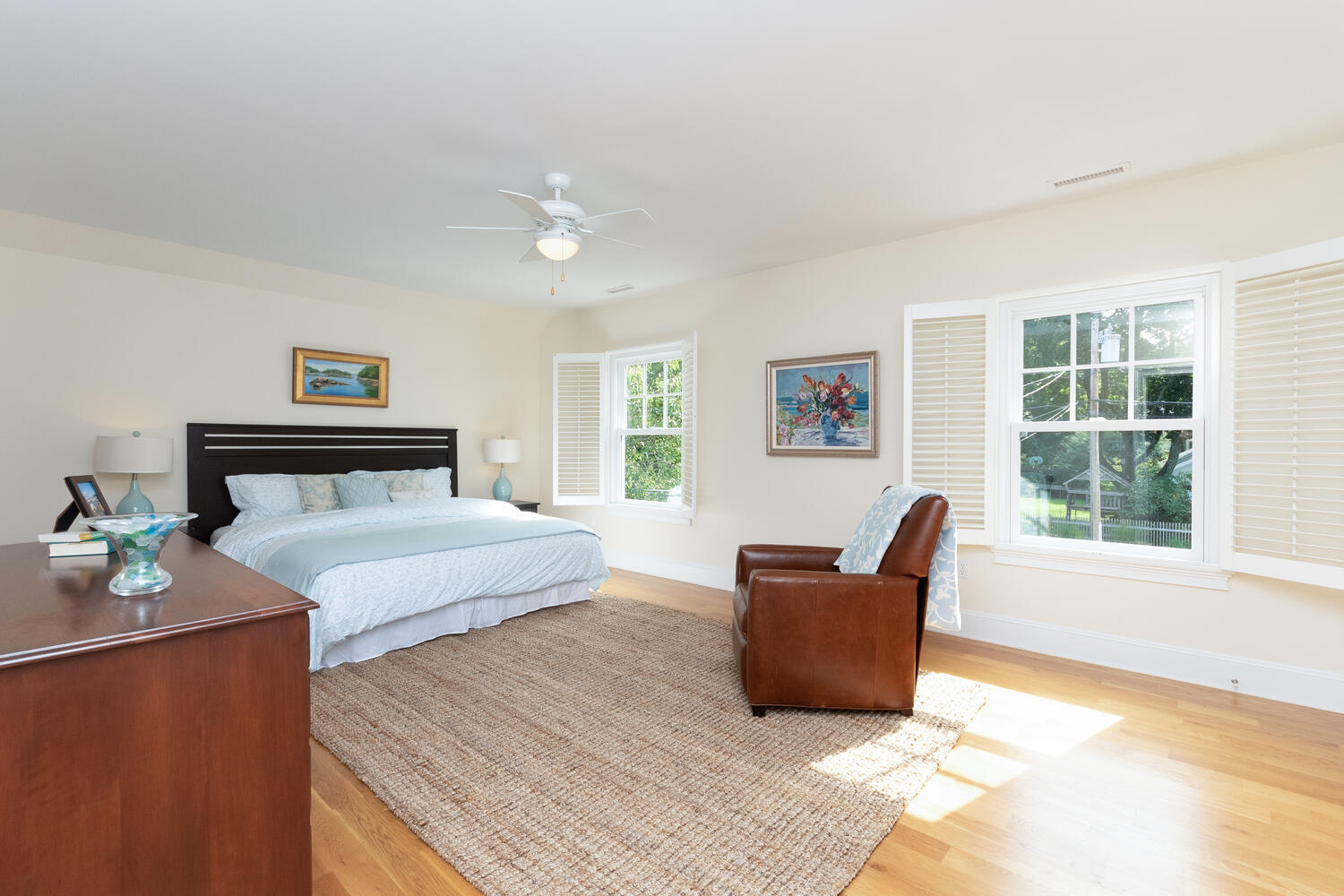 11 Harstrom Place Rowayton, CT 06853 - Photo 16 of 22 a spacious bedroom with a bed and wooden floor