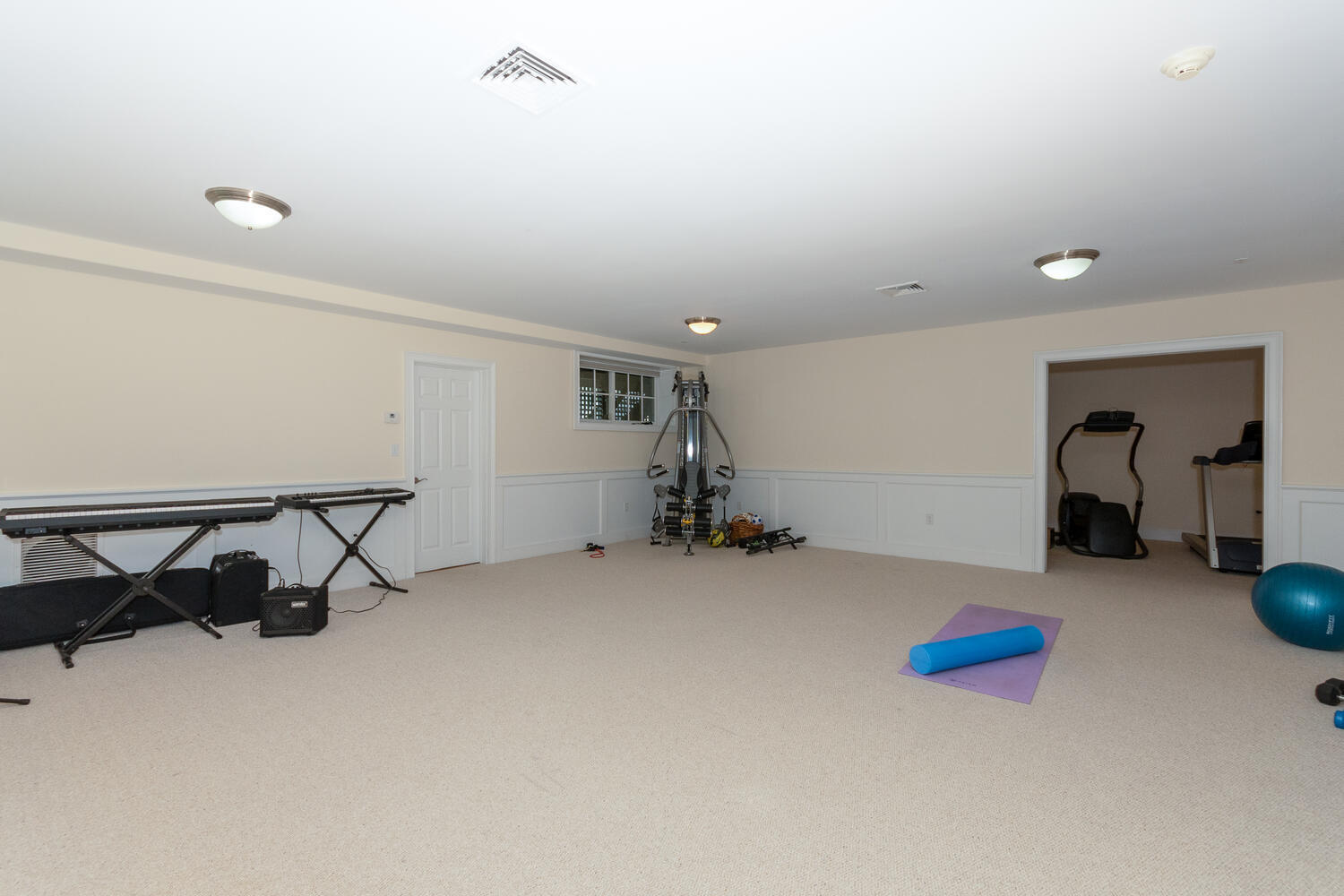 11 Harstrom Place Rowayton, CT 06853 - Photo 18 of 22 a room with gym equipment and a view of living room