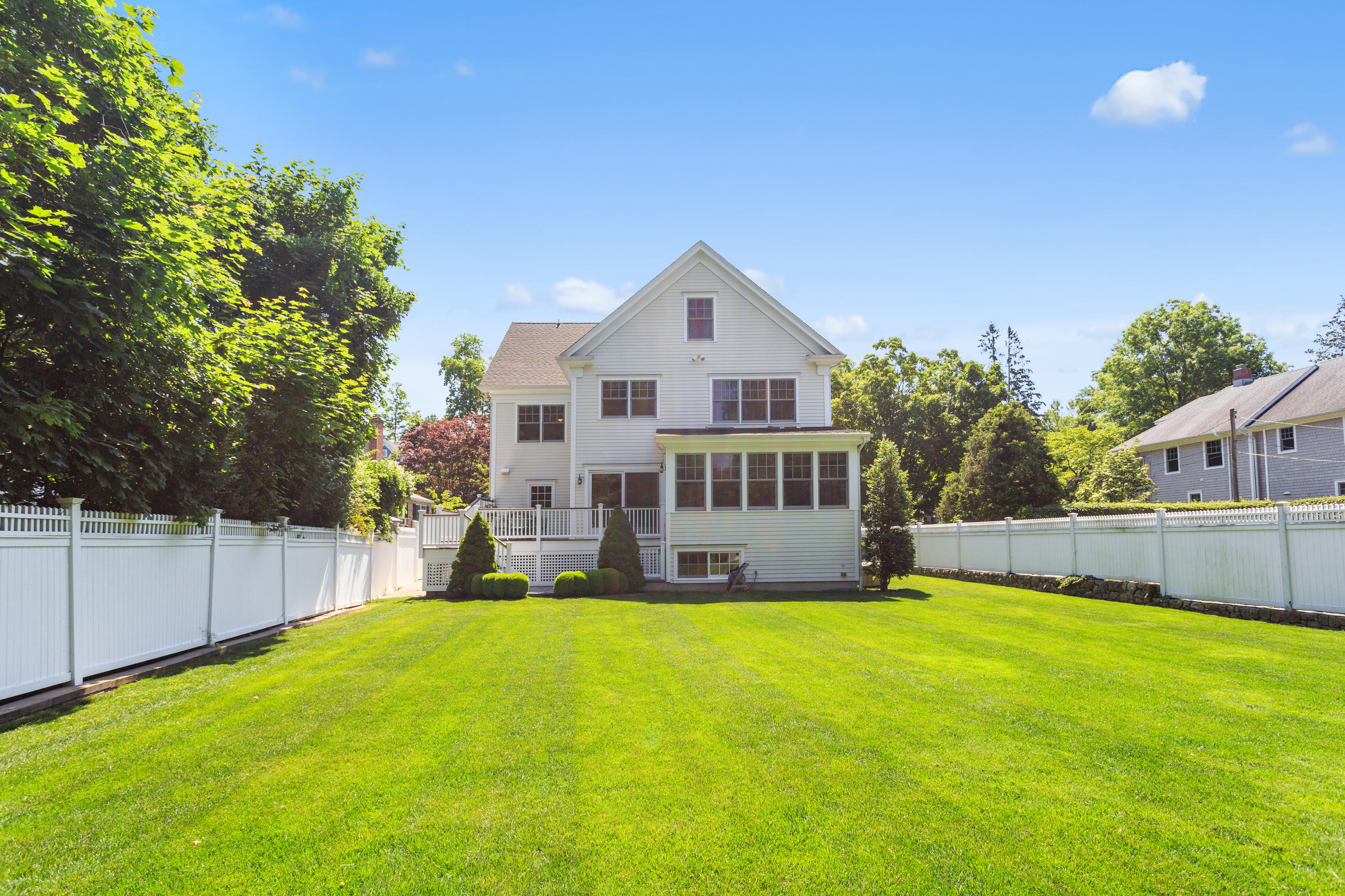 11 Harstrom Place Rowayton, CT 06853 - Photo 2 of 22 a view of a house with a big yard and potted plants