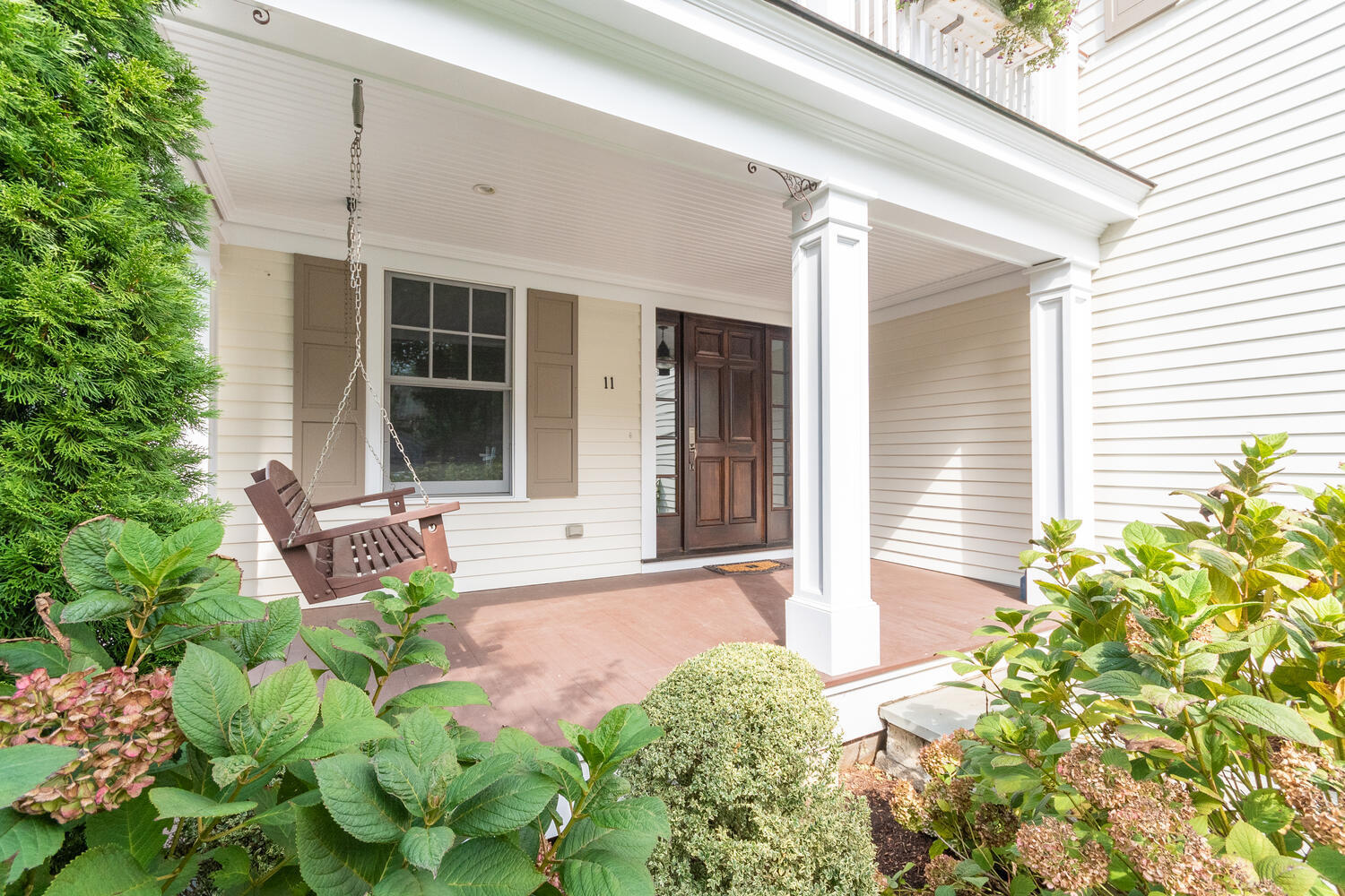 11 Harstrom Place Rowayton, CT 06853 - Photo 3 of 22 a front view of a house with garden