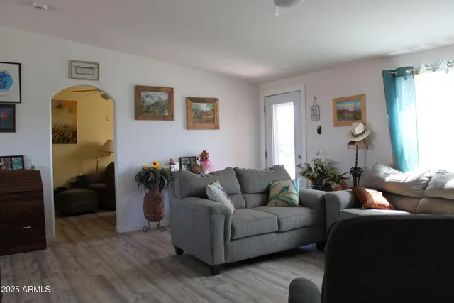 a living room with furniture and a window