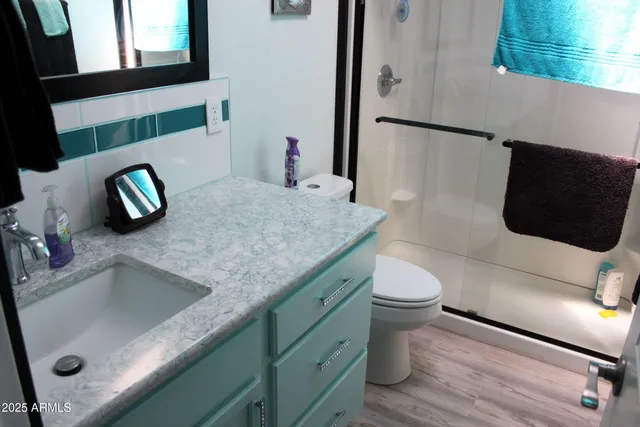 a bathroom with a sink mirror and vanity