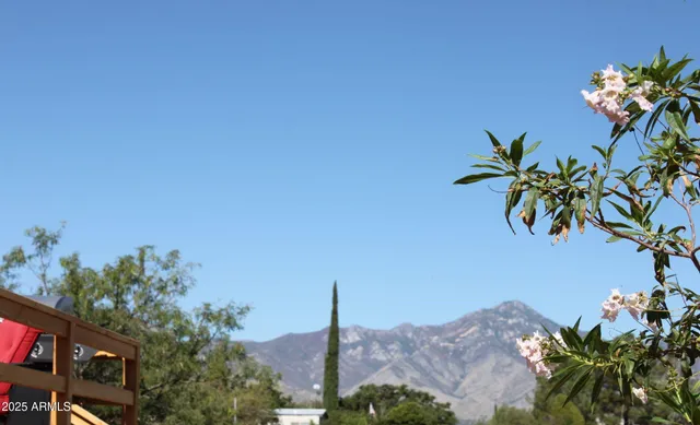 a view of a barn in the middle of a yard