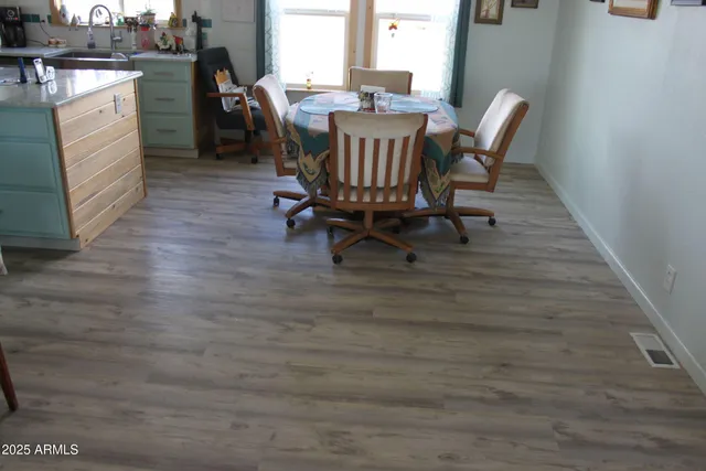 a kitchen with stainless steel appliances granite countertop a sink and cabinets