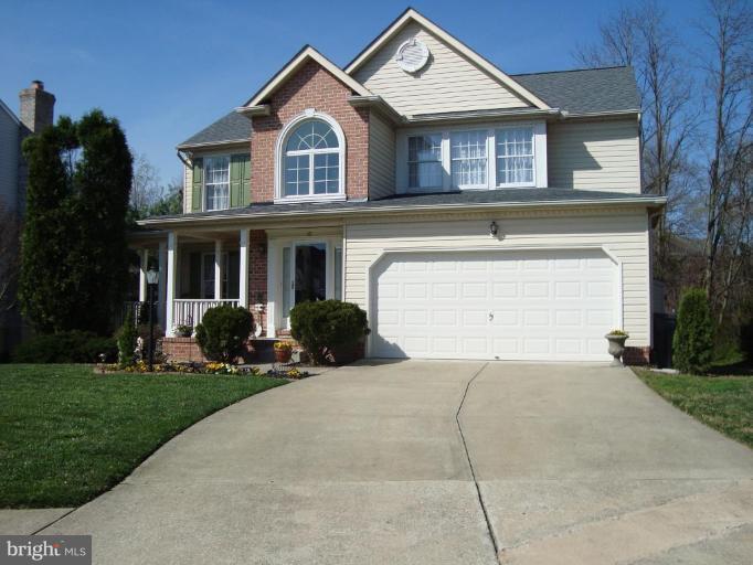 10 Trumpet Court Nottingham, MD 21236 - Photo 2 of 17 a front view of a house with a yard and garage