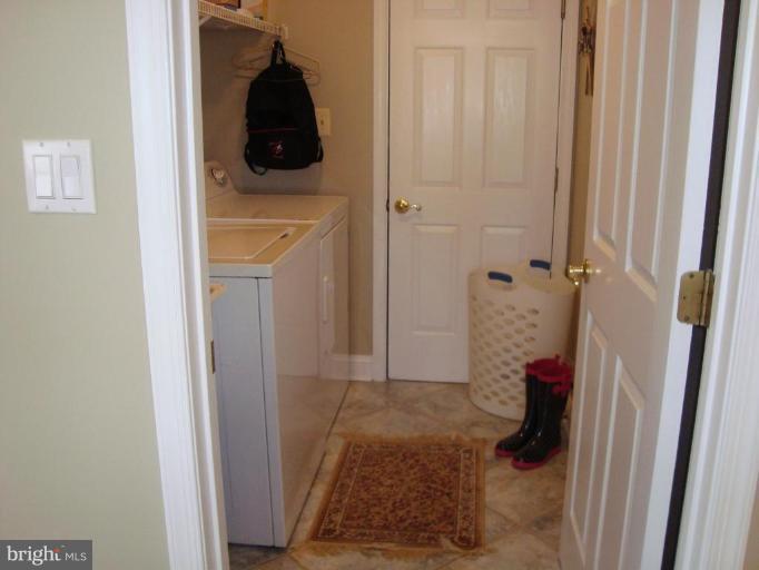10 Trumpet Court Nottingham, MD 21236 - Photo 12 of 17 a bathroom with a granite countertop shower and a toilet