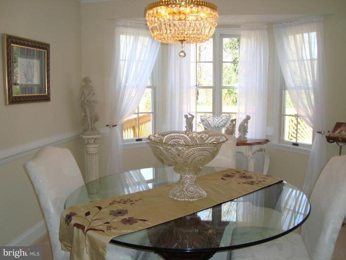 10 Trumpet Court Nottingham, MD 21236 - Photo 16 of 17 a view of a dining room with furniture and a chandelier