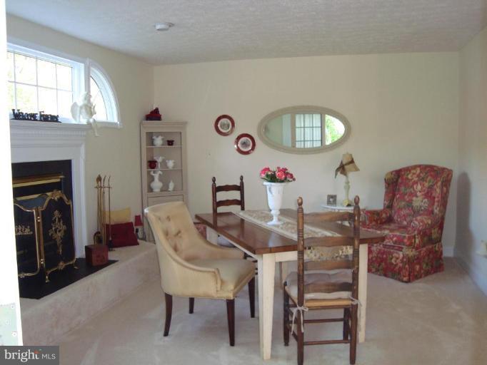 10 Trumpet Court Nottingham, MD 21236 - Photo 7 of 17 a dining room with furniture and a fireplace
